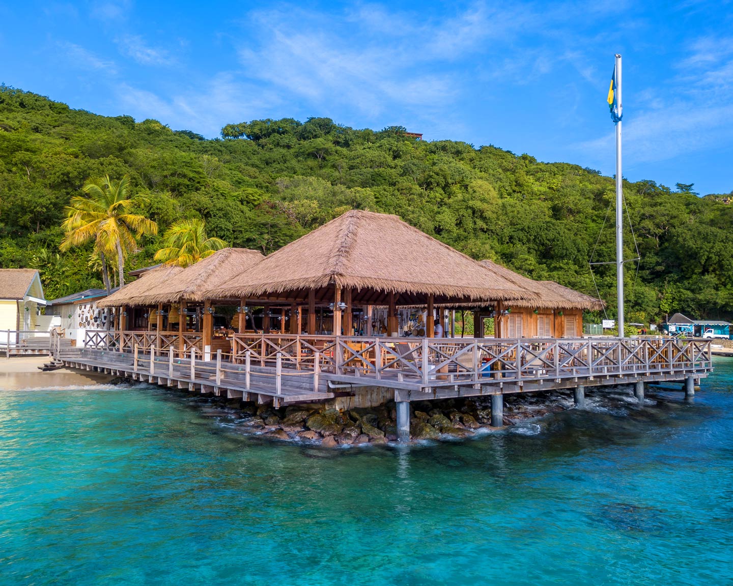 Aerial view of Basil's Bar on stilts over the water in Mustique